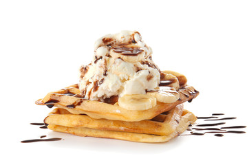 Tasty waffles with banana, chocolate and ice-cream on white background