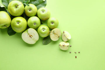 Fresh ripe apples on color background