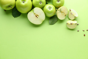 Fresh ripe apples on color background