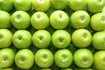 Many fresh ripe apples as background