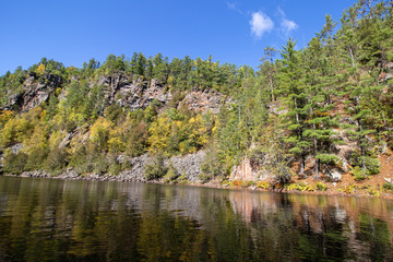 Fototapeta na wymiar Colorful Barron Canyon from the river on a bright fall day in Algonquin Park Ontario 