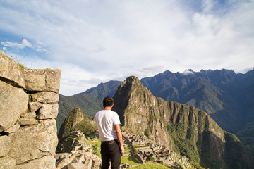 Traveller at the Lost city of the Incas, Machu Picchu,Peru on top of the mountain, with the view panoramic