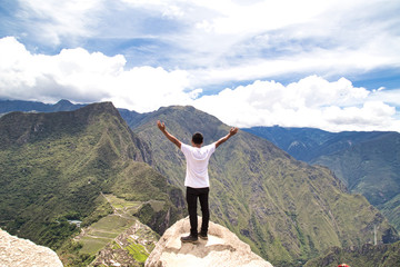 Obraz premium Traveller at the Lost city of the Incas, Machu Picchu,Peru on top of the mountain, with the view panoramic