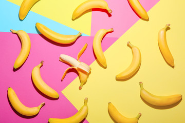 Ripe bananas on color background