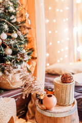 New Year mood, Christmas tree. Cozy room with bed, table and cozy knitted blanket. New Year 2019, flat lay. Composition with a deer and a Christmas tree.