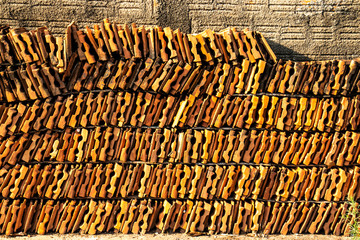 Stack of clay tile  It arranged vertically with wall background in Brazil