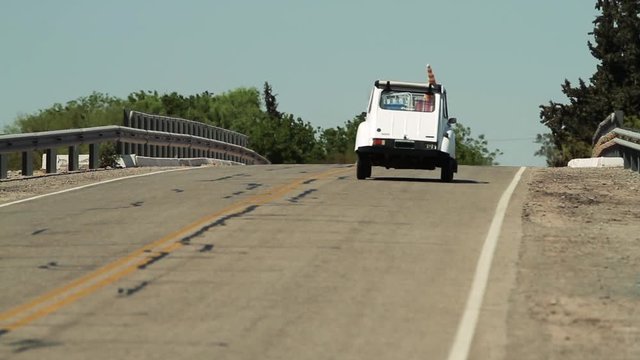 Old White Car on Road, Back View.