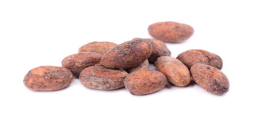 Unpeeled cacao beans, isolated on white background. Roasted and aromatic cocoa beans, natural chocolate.