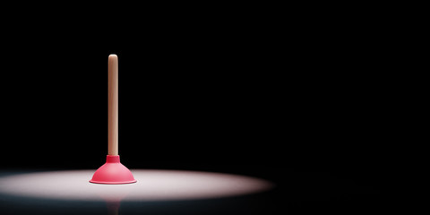 Plunger Spotlighted on Black Background