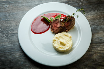 top view on trendy restaurant dish of grilled meat with mashed potato