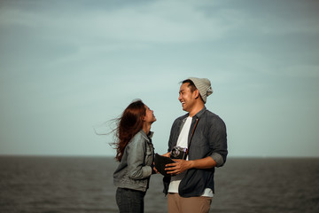 Young Asian couple in blue shirt  enjoy together happy and smile  romantic time together