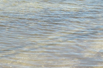Light blue rippled water surface on Florida river, natural water background