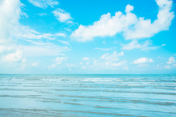 Beautiful beach, sea water, clear sky at morning with gentle wind waves. Concept for a nice holiday vacation.