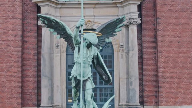 4K Aerial Archangel statue in St. Michael's Church, Hamburg, ascending view - Slow Motion
