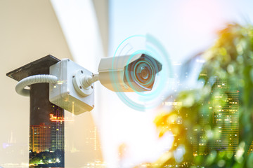 Double exposure technician installation CCTV camera on a pole , show signal , blurred background...