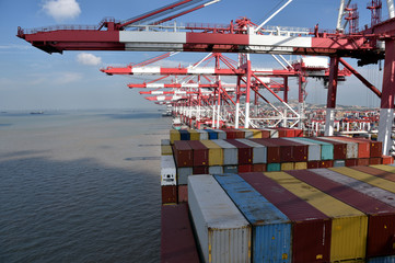 Gantry cranes during cargo operations, loading and unloading containers. on the cargo ships.