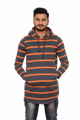 Fototapeta premium Young handsome Indian man isolated against white background
