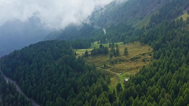 Aerial flight over trees at grossglockner high alpine road, 4k