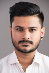 Obraz premium Face of young handsome Indian man looking at camera