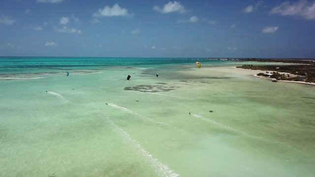 Aerial of Kite Surfers in Tropical Blue Ocean. Anegada, Caribbean.