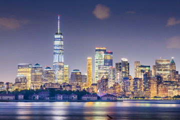 Fototapeta na wymiar New York, New York, USA skyline from the harbor with Ellis Island