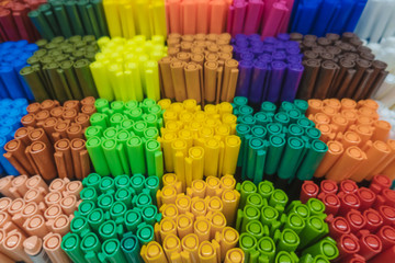 Close up on top view on variety of many colorful pens are in box on shelf stack sale point are in box at stationery store.