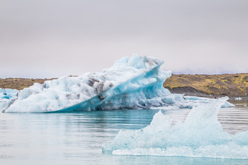 Fototapeta na wymiar Blue icebergs in Glacier Lagoon in Iceland