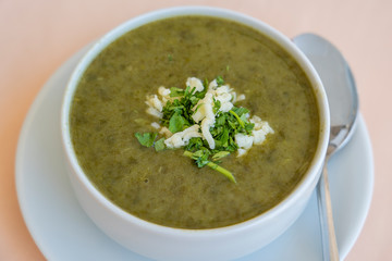 Green cream soup from spinach, close up