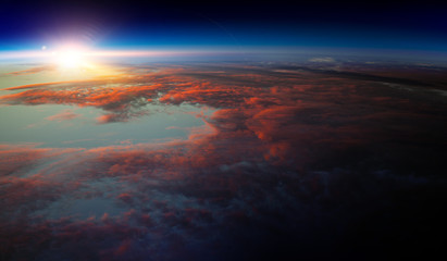 Earth with sunrise on blue space background