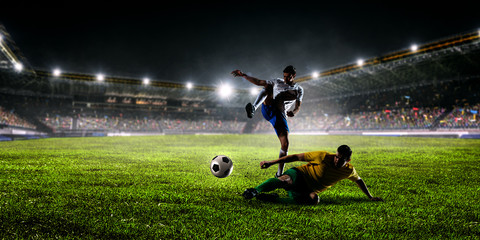 Soccer players on stadium in action