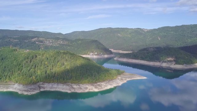 Ascending stunning 4k aerial shot of Lake Zaovine and Tara mountain, Serbia