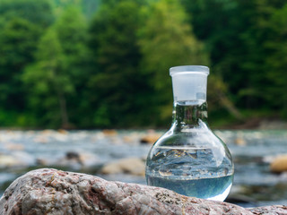 Glass flask with clean drinking water.