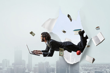 Torn paper hole effect with levitating businessman