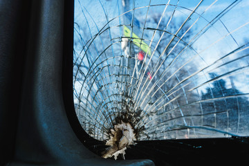 broken glass and tempered with transparent duct tape in a passenger bus