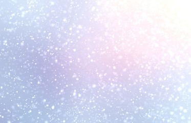 Winter outside blurred background. Snowfall fluffy light texture. Natural silhouette blue pink white colors. 