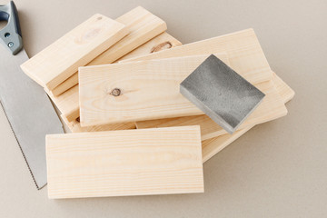 Wood saw and small planks.