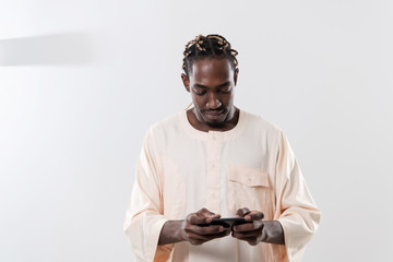 african man using smartphone