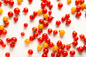 Red and yellow cherry tomatoes isolated on white background. Fresh bright organic vegetables.