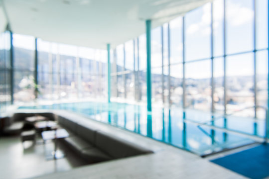 Indoor swimming pool in blur background. Abstract blurry swimming pool in fitness centre.