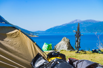 Fototapeta premium Bike repair against nature fjord, Norway