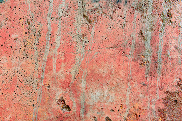 Texture of a concrete wall with cracks and scratches which can be used as a background