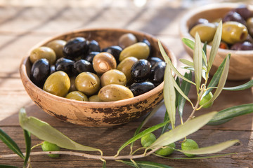 bowls with different kind of olives : green black kalamata olives with olive oil