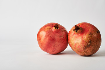 pomegranate fruits on white background.
