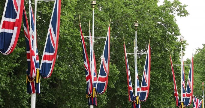 Flags Of The United Kingdom In Front Of Buckingham Palace