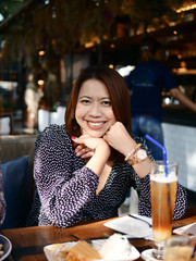 Asian woman relaxing at coffee shop, lifestyle concept.