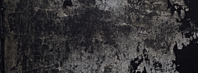 old black paint texture peeling off the concrete wall for dark theme banner background