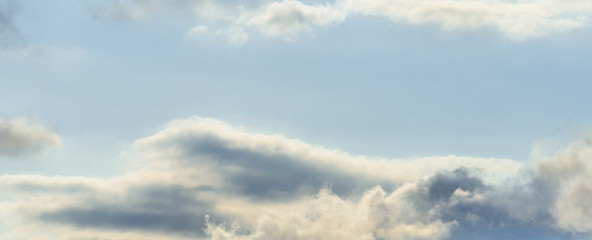 Beautiful puffy clouds isolated against blue skies