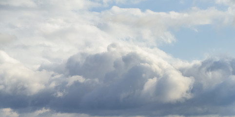 Beautiful puffy clouds isolated against blue skies