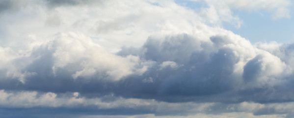 Beautiful puffy clouds isolated against blue skies