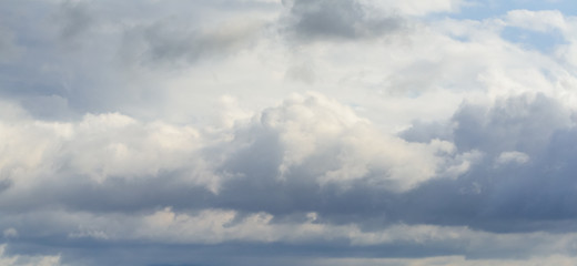 Beautiful puffy clouds isolated against blue skies